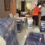 Home Movers Malaysia team protecting belongings during rainy weather